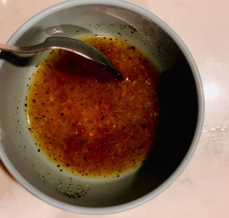 Step 1.1: In a separate small bowl, whisk together the lemon juice, olive oil, maple syrup, salt, and black pepper until well combined