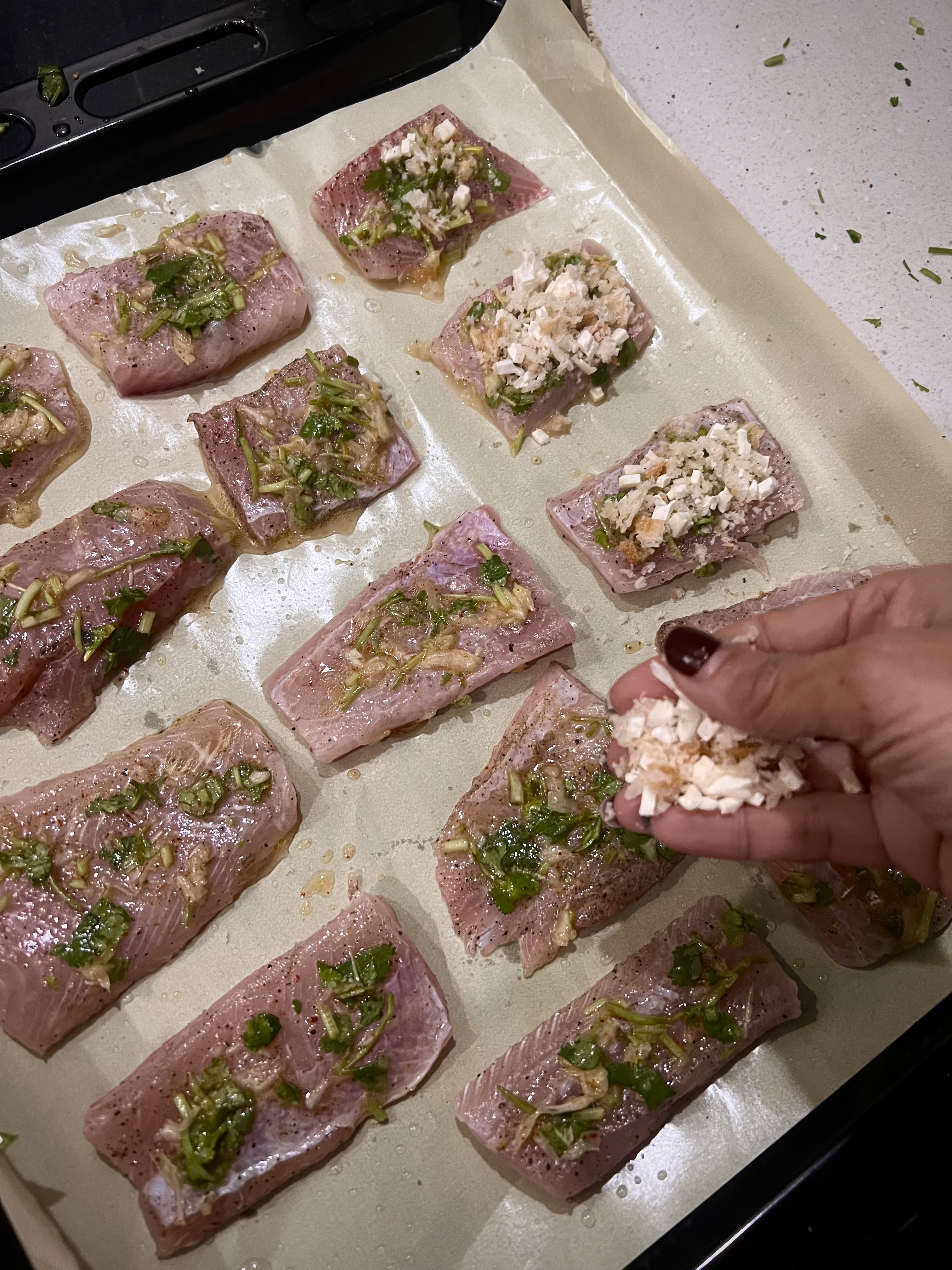 Step 1.1: Spread the breadcrumb mixture evenly on top of the fish