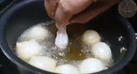 Step 2.1: Take a small piece of dough, about the size of a Gooseberry, and add it to the hot oil