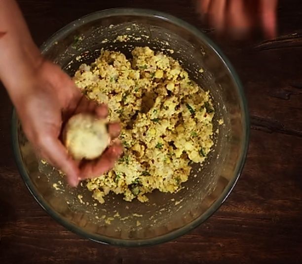 Step 4.1: Take a small portion from the batter, roll it with your hand, and gently flatten it with your palm (not too thick)