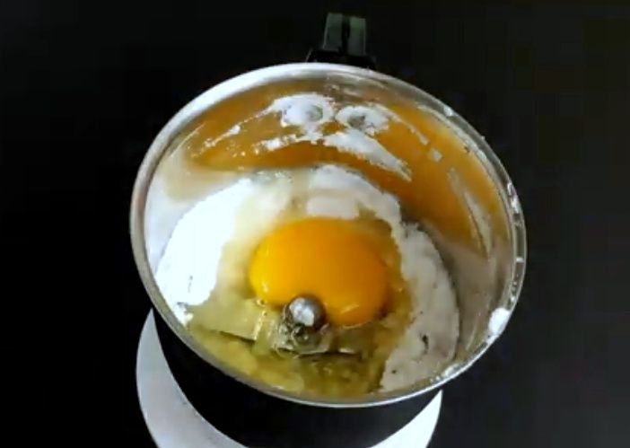 Step 1.1: Add egg, vanilla essence, salt, and oil to the powdered sugar and blend well