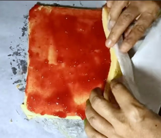 Step 1.1: Roll it again and cover it with foil or butter paper
