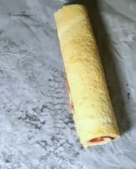Step 1.2: Roll it again and cover it with foil or butter paper
