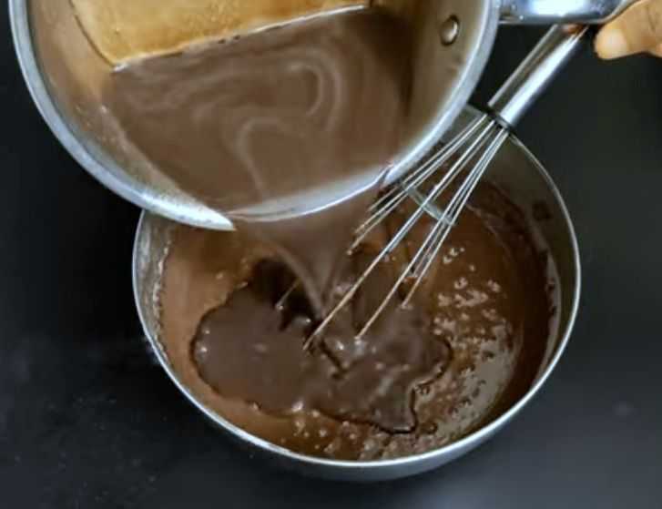 Step 1.1: Pour the hot milk mixture into the cake mix and mix well