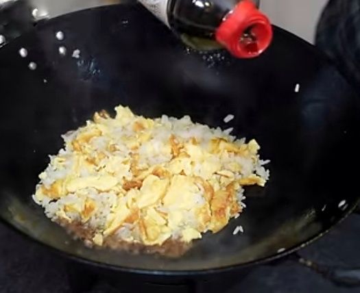 Step 1.1: Add the soy sauce to the hot wok or khadai