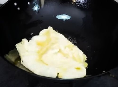 Step 1.1: When it becomes hot, add the eggs and lower the heat