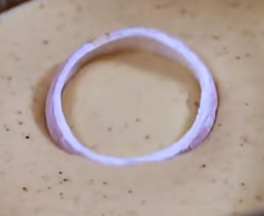 Step 1.1: Dip the flour-coated onion rings into the batter