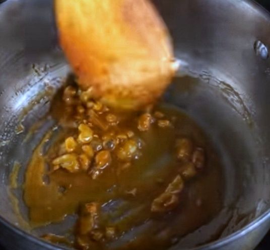 Step 2.1: Add cashew nuts, mix, and remove from the flame