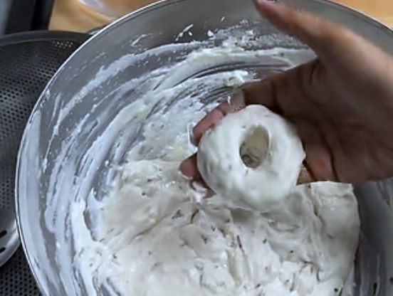 Step 1.1: Make a hole in the center with your finger and drop it into the hot oil by inverting your hand over the oil