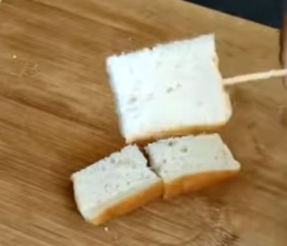 Step 1.1: Insert the stick into the bread pieces