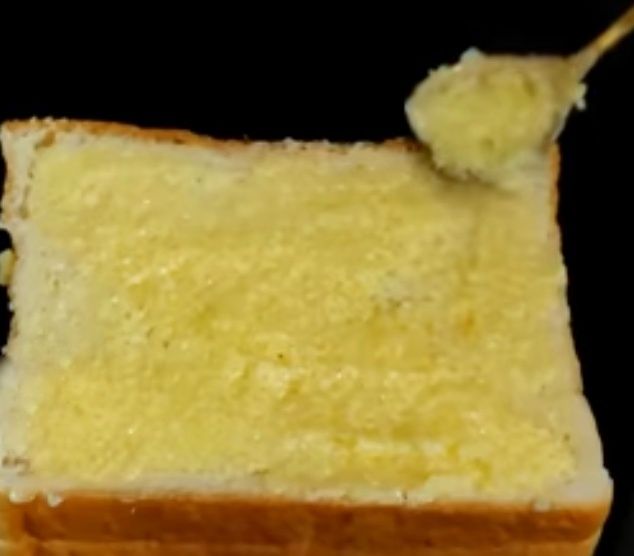 Step 1.2: Place another bread slice on top and spread the butter-sugar mixture on both sides