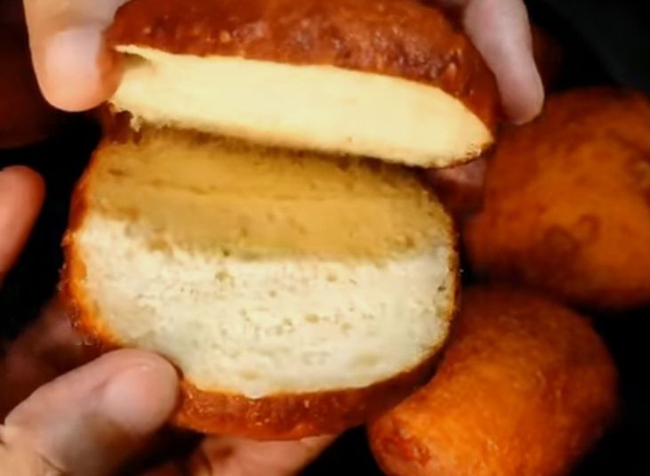 Step 4.2: Take the cooled fried buns and slit them open in half