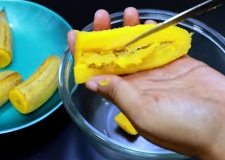 Step 2.1: Peel the banana and remove the black seeds from the middle, then slightly mash it