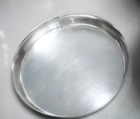 Step 1.1: Grease a steel plate with some ghee and pour 2-3 tbsp of batter onto it (quantity of batter depends on the size of the plate)