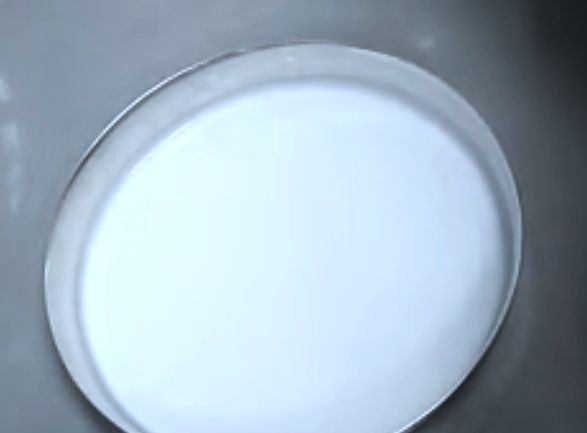 Step 1.2: Tilt the plate so the batter spreads evenly to form a thin layer