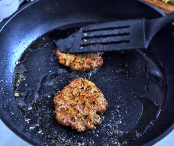 Step 4.1: Pour some butter and place one meatball on the hot pan