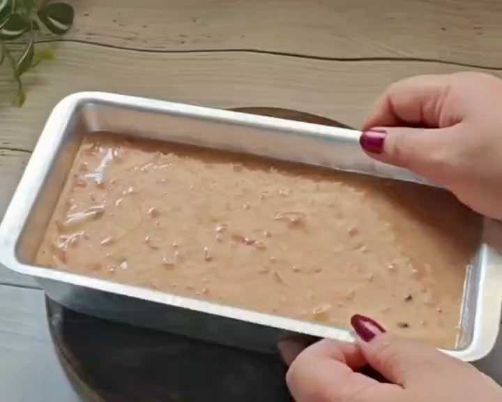 Step 4.1: Transfer the batter to a greased tin lined with parchment paper