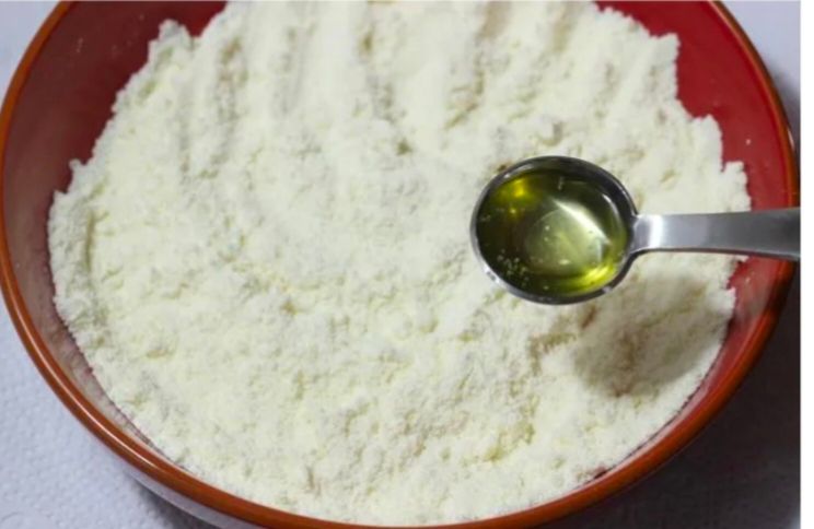 Step 1.1: Add ghee and mix well to make the flour moist