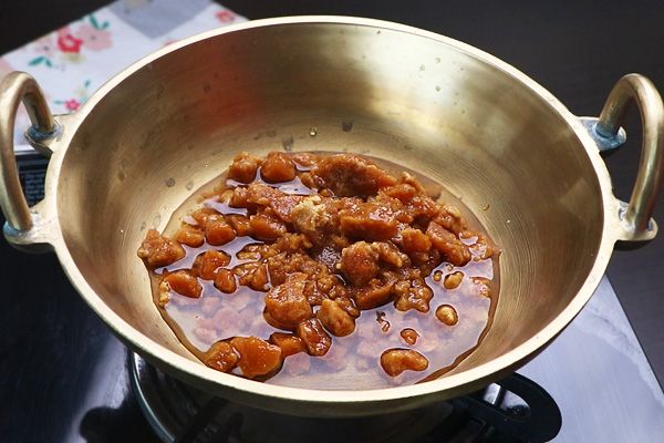Step 2.1: Add jaggery with water and heat until it completely dissolves