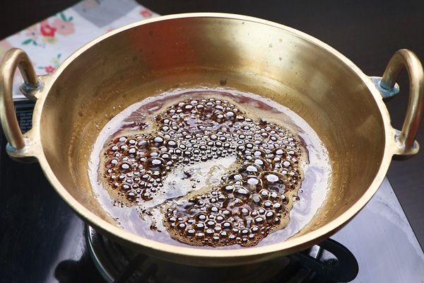 Step 2.2: Add jaggery with water and heat until it completely dissolves