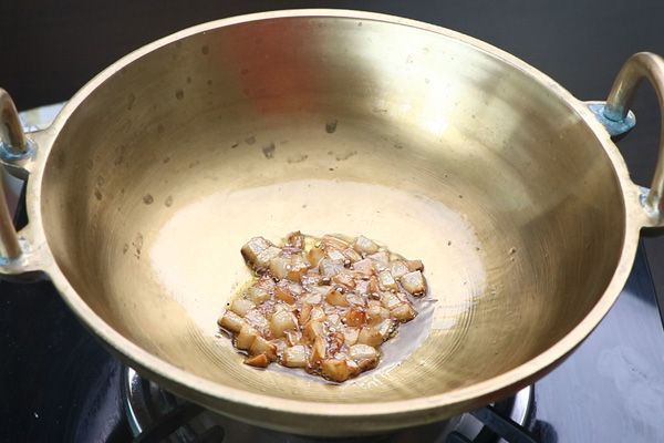 Step 2.1: Add coconut and fry until golden brown