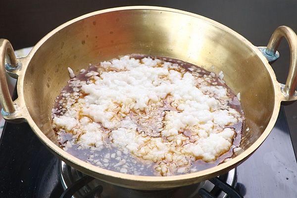 Step 2.1: Add strained jaggery syrup and cook until the syrup is thick, about 10 minutes