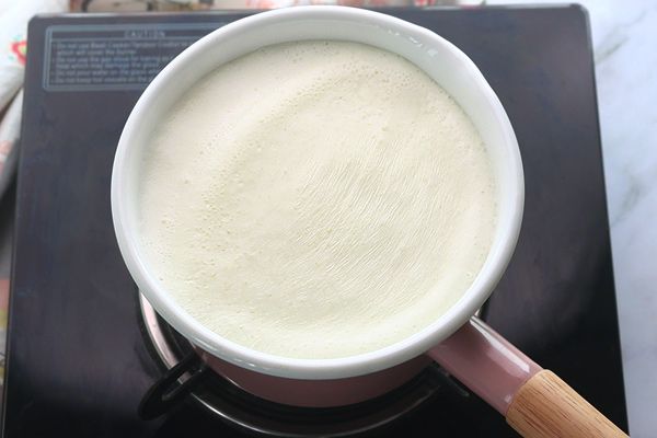 Step 1.1: Meanwhile, boil milk and simmer for 3-5 minutes, then switch off the heat