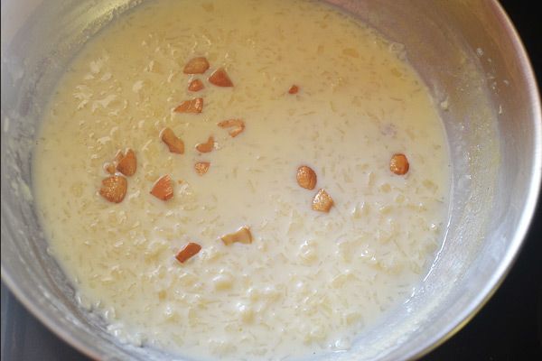 Step 3.1: Heat ghee and add broken cashews, frying until golden brown