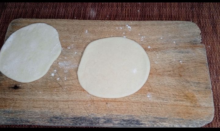 Step 1.2: Roll each of them, circle shaped and form an attachment of two by apply oil and flour sprinkles in between
