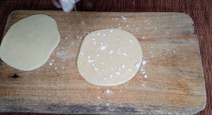 Step 1.1: Roll each of them, circle shaped and form an attachment of two by apply oil and flour sprinkles in between