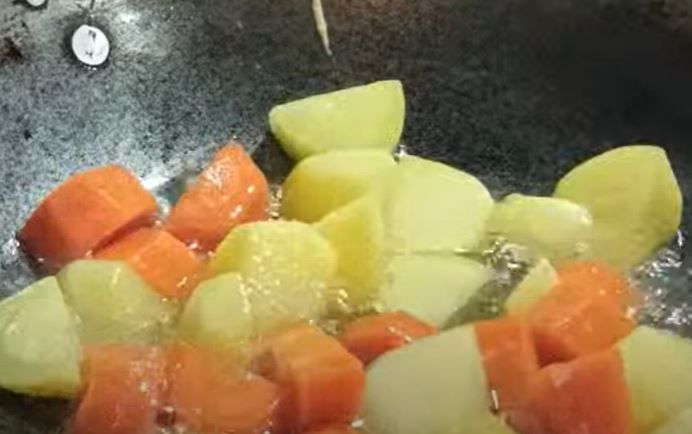 Step 1.1: In a skillet, pan-fry the diced potatoes and carrots until lightly golden
