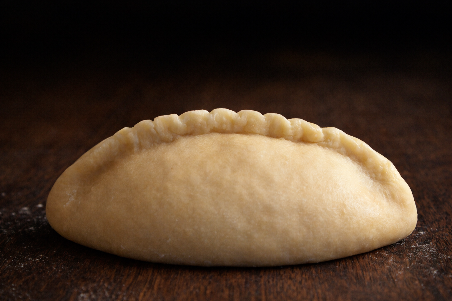 Step 5.1: Fold the dough over the filling and seal the edges firmly