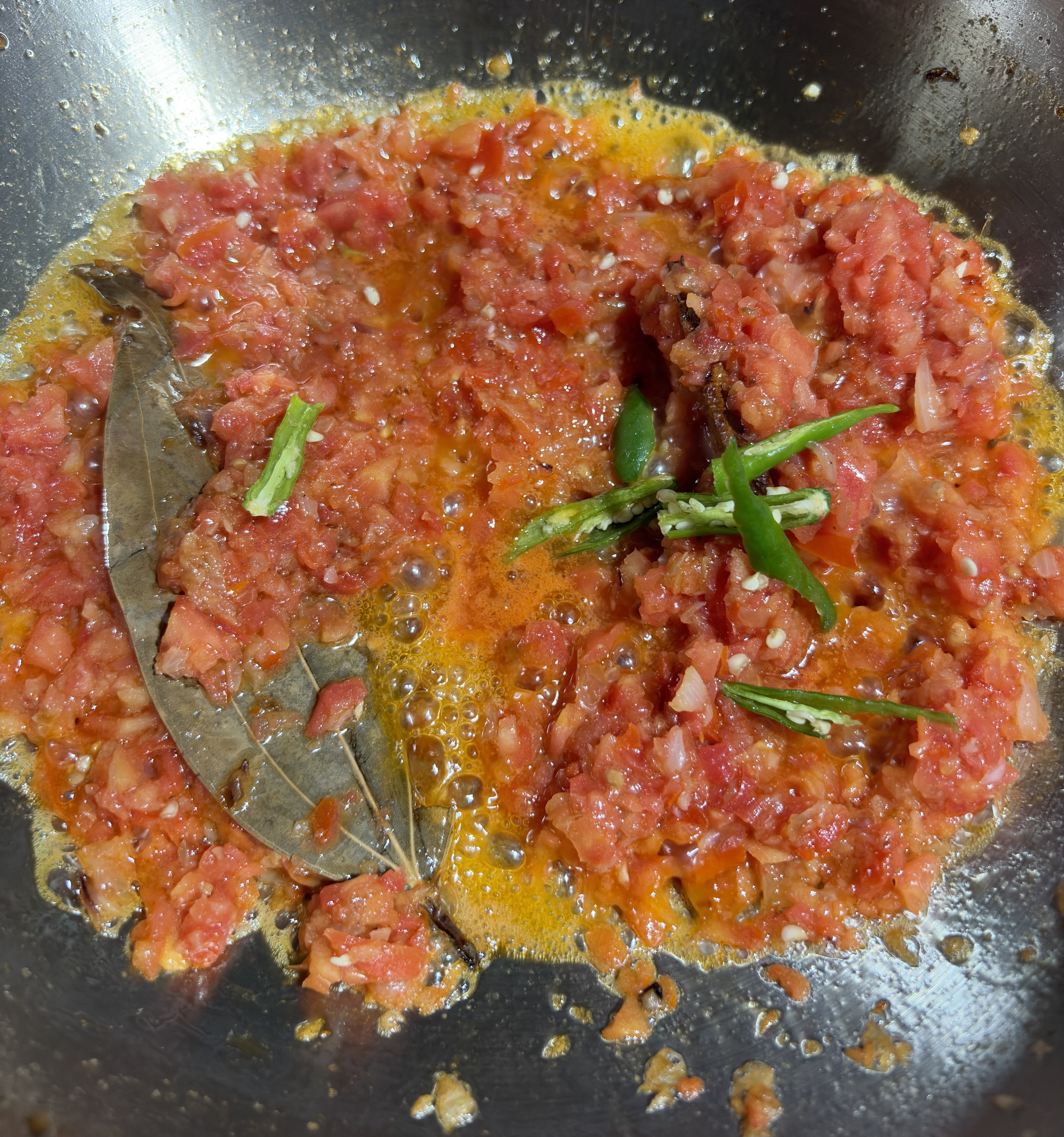 Step 4.1: Add the tomatoes and green chillies