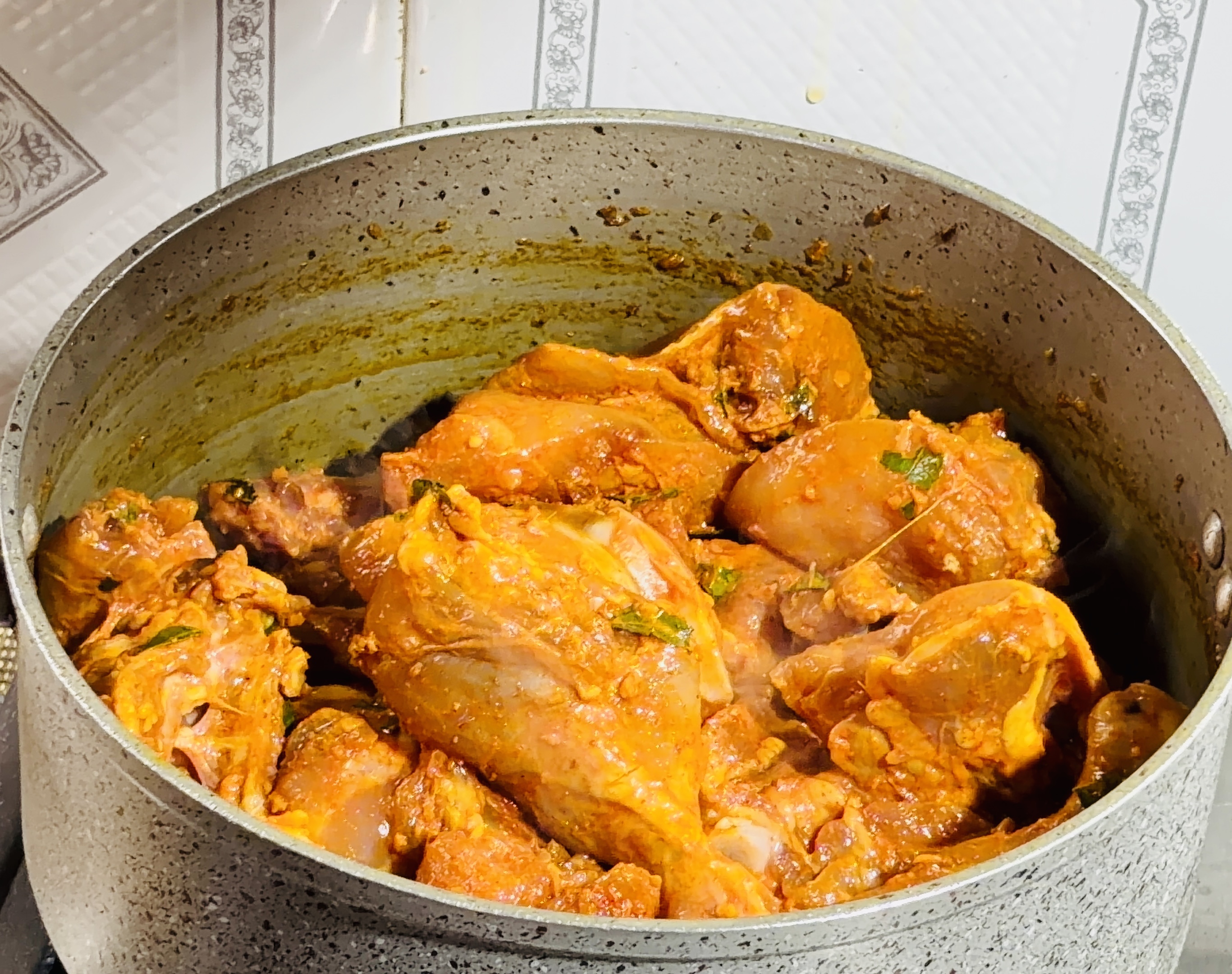 Step 2.1: Add the marinated chicken and cook on high heat, stirring, until the chicken changes color and gets well coated