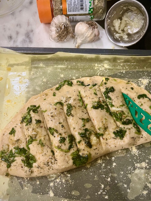 Step 3.1: Score the top into pieces lightly with a sharp knife and brush with garlic butter