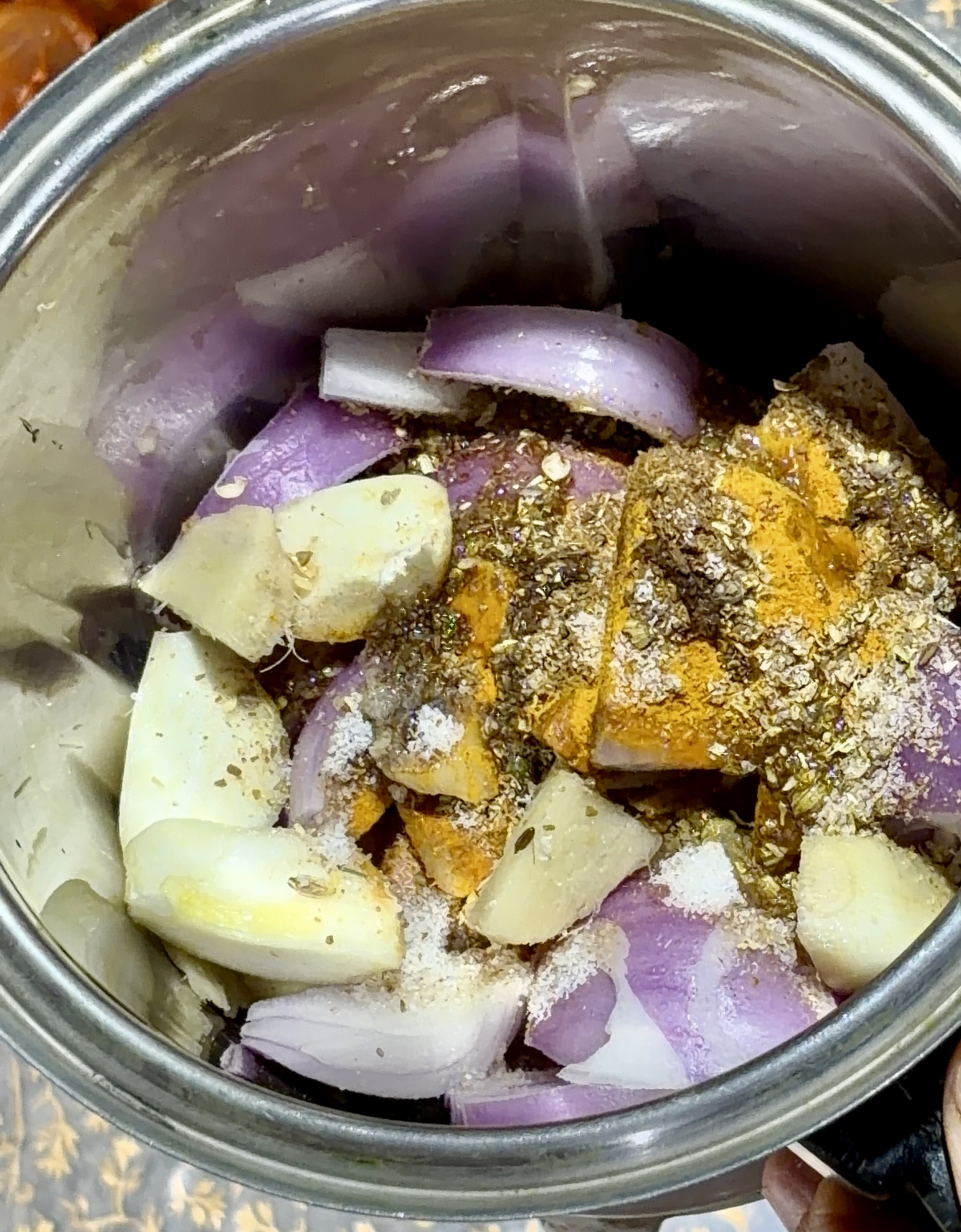 Step 3.1: In a blender, add onions, garlic, ginger, turmeric, coriander powder, cumin powder, salt, and oil