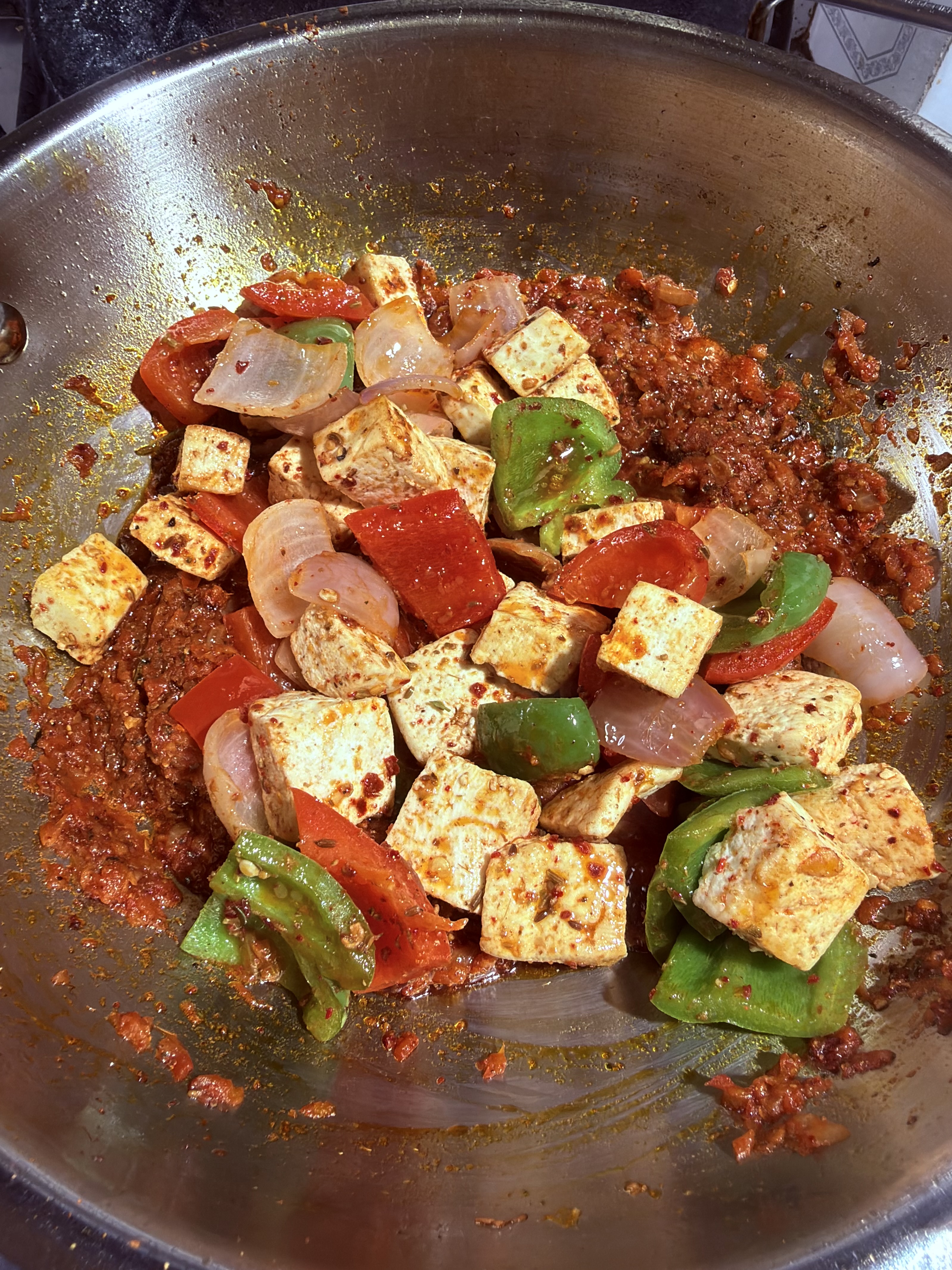 Step 4.1: Add the seared paneer and vegetables, mixing gently to avoid breaking the paneer