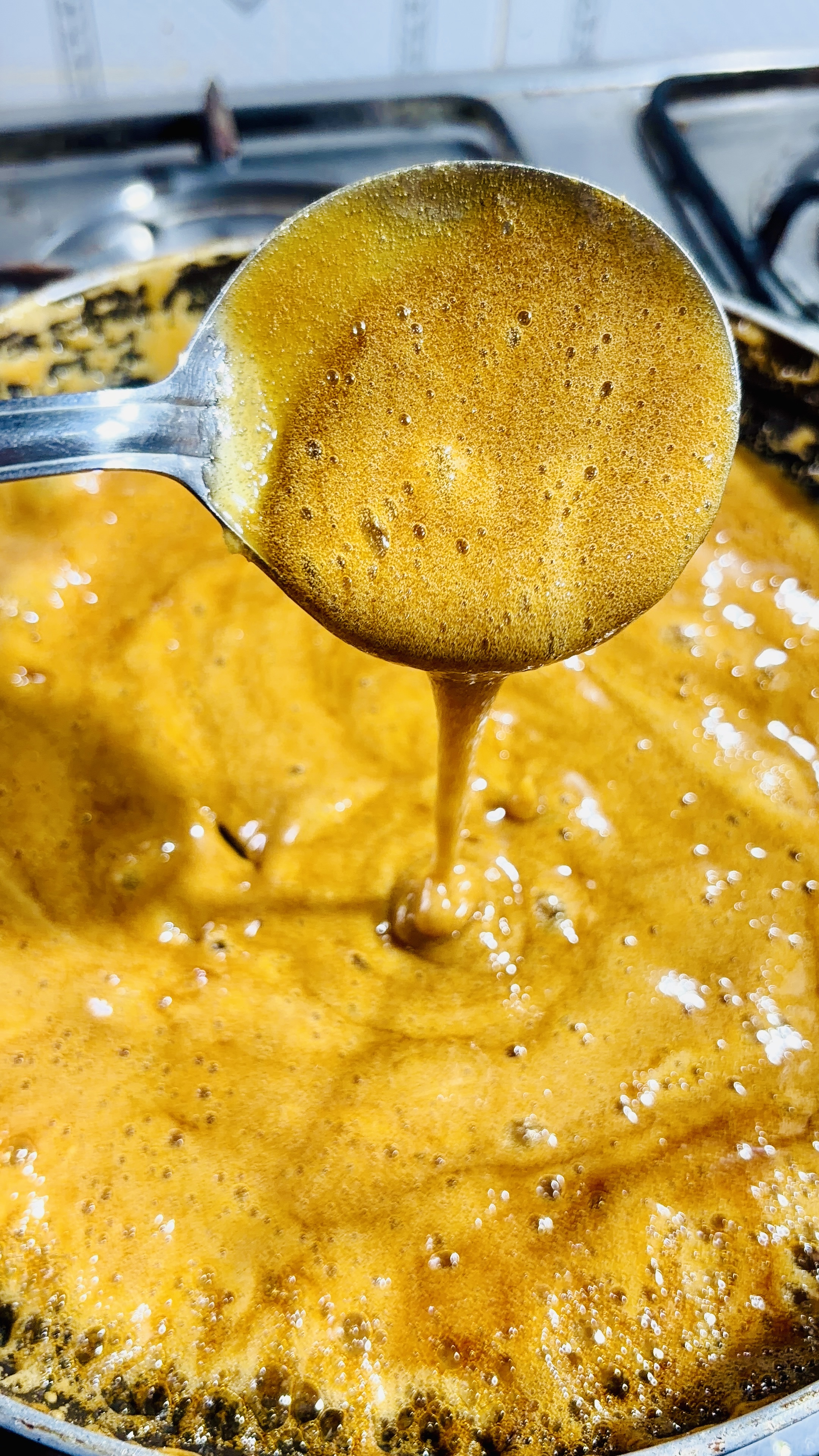 Step 3.1: Continue cooking on medium heat, stirring regularly, until the mixture thickens and reaches a candy-like consistency