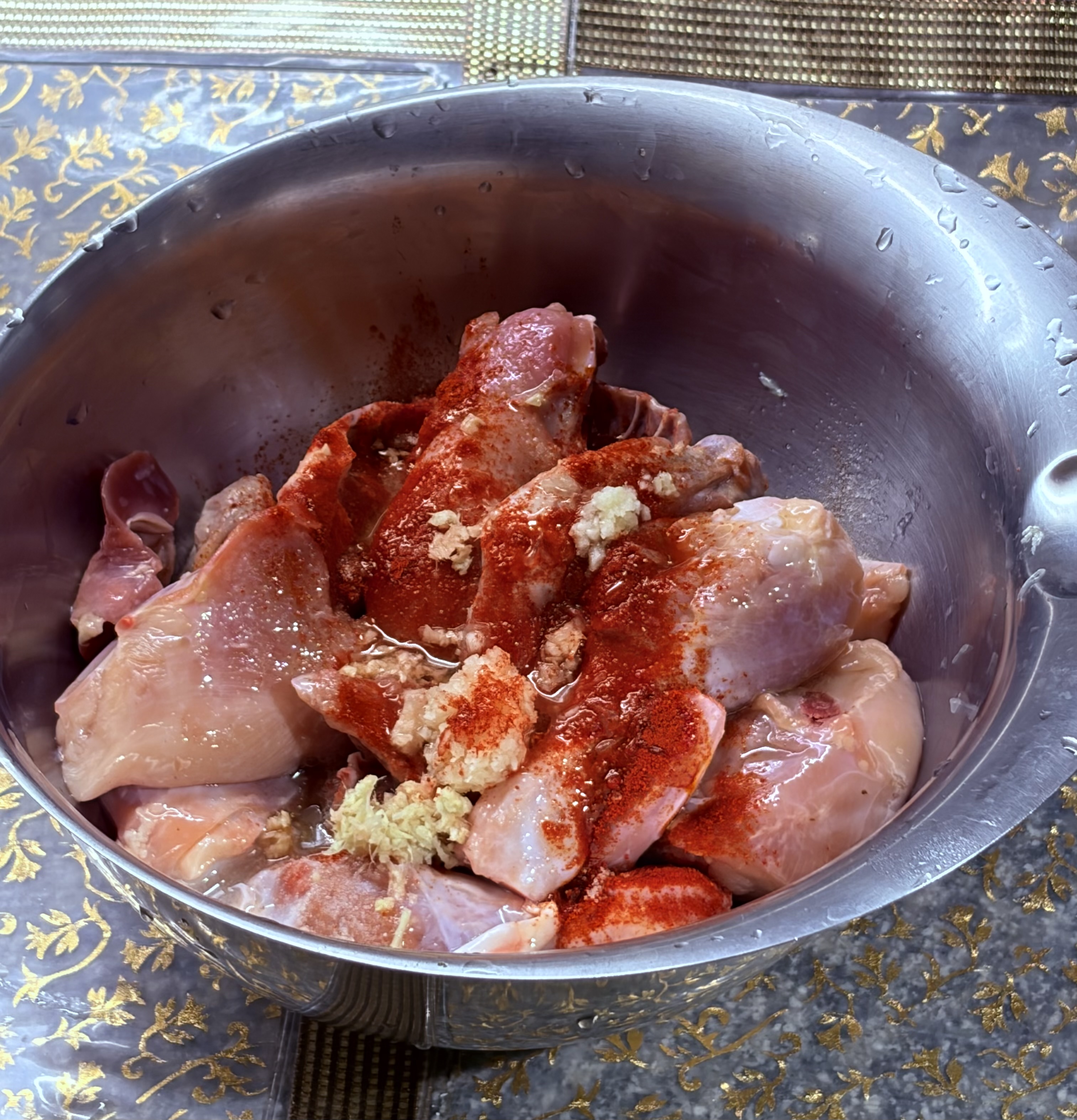 Step 1.1: Mix in Kashmiri chilli powder, salt, lemon juice, chopped ginger and garlic, and oil