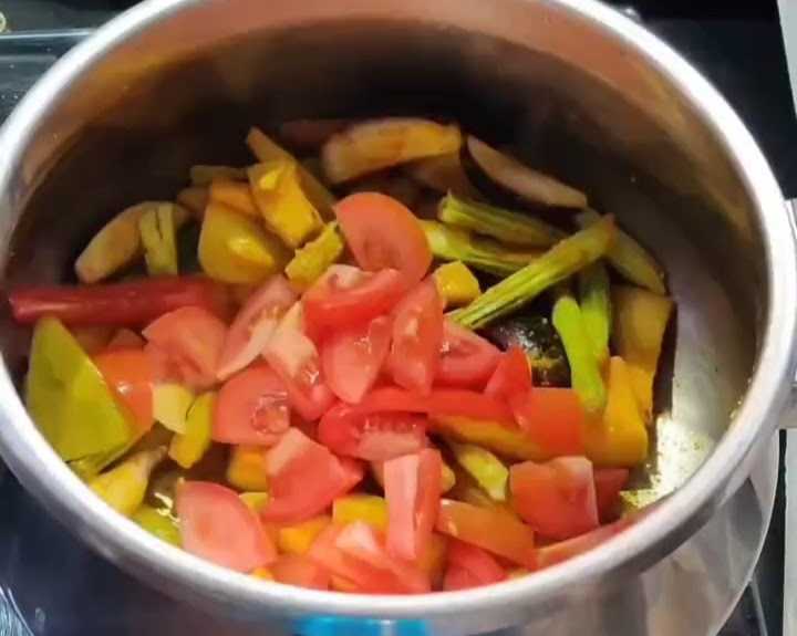 Step 2.1: Add chopped tomatoes and cook for a few more minutes