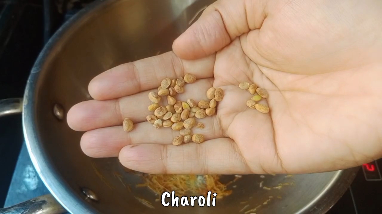 Step 1.1: Add charoli to the pan and roast it briefly with the sevaiya