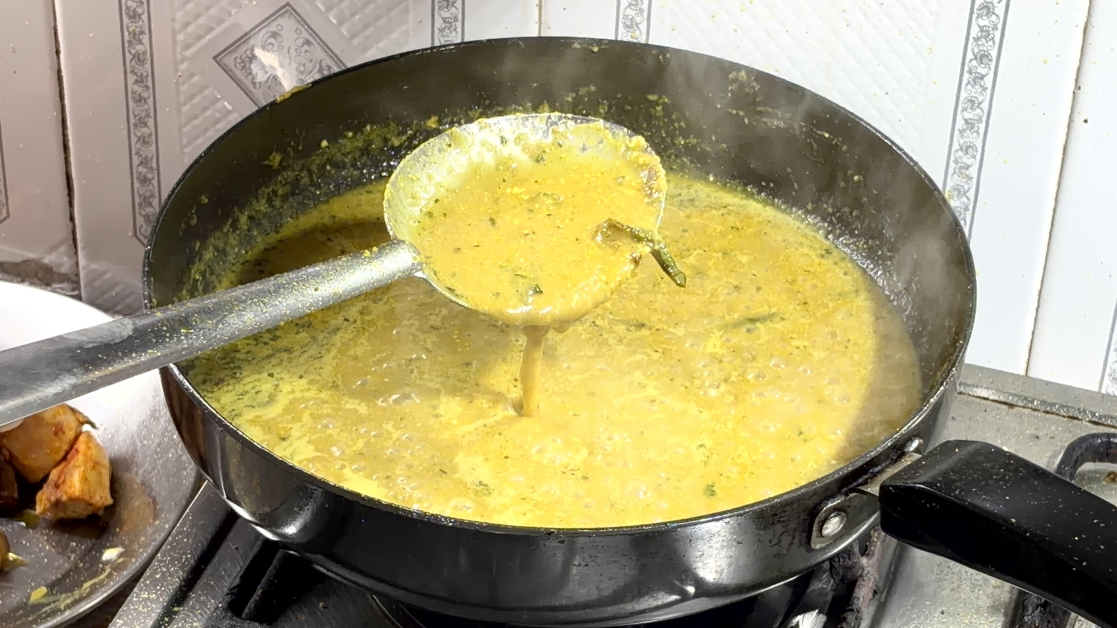 Step 4.1: Pour in hot water, then add garam masala and crushed kasuri methi