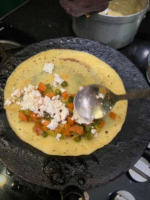 Step 4.1: Place sautéed vegetables and paneer on one side