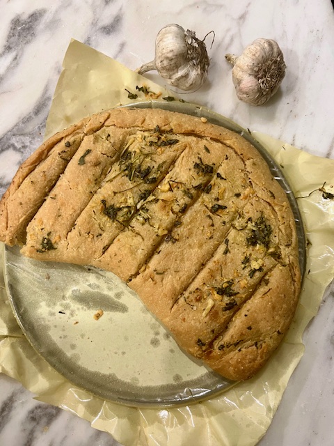 Step 5.1: Brush hot bread with extra garlic butter