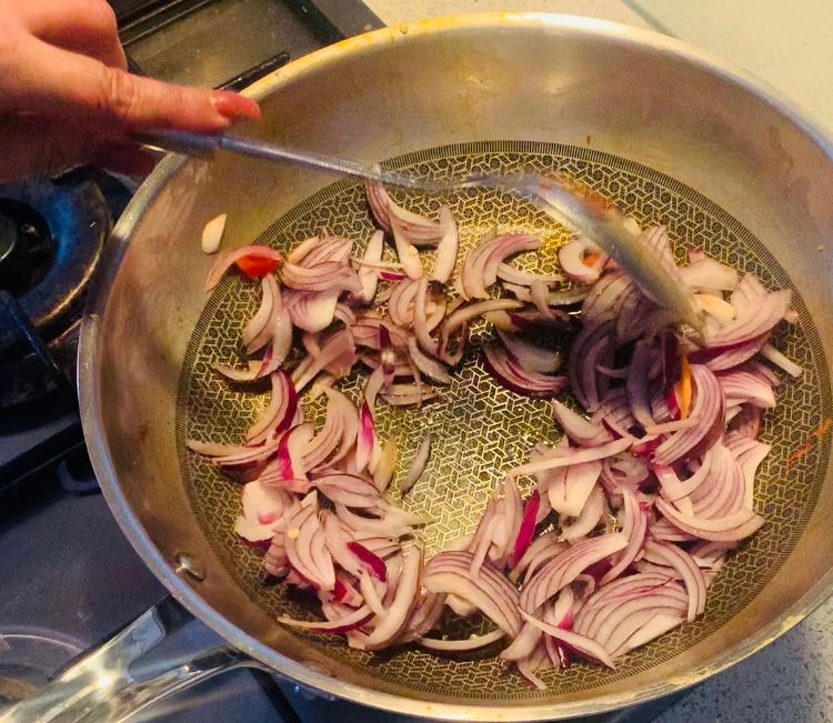 Step 1.1: Add another teaspoon of oil to the pan and add the sliced onions