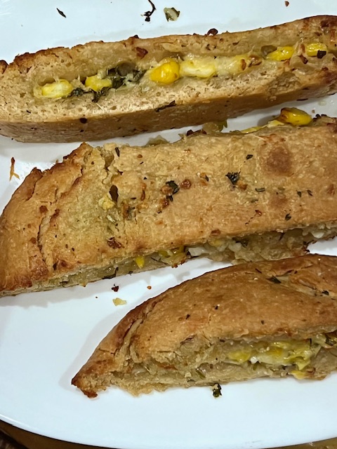 Step 5.3: Brush hot bread with extra garlic butter