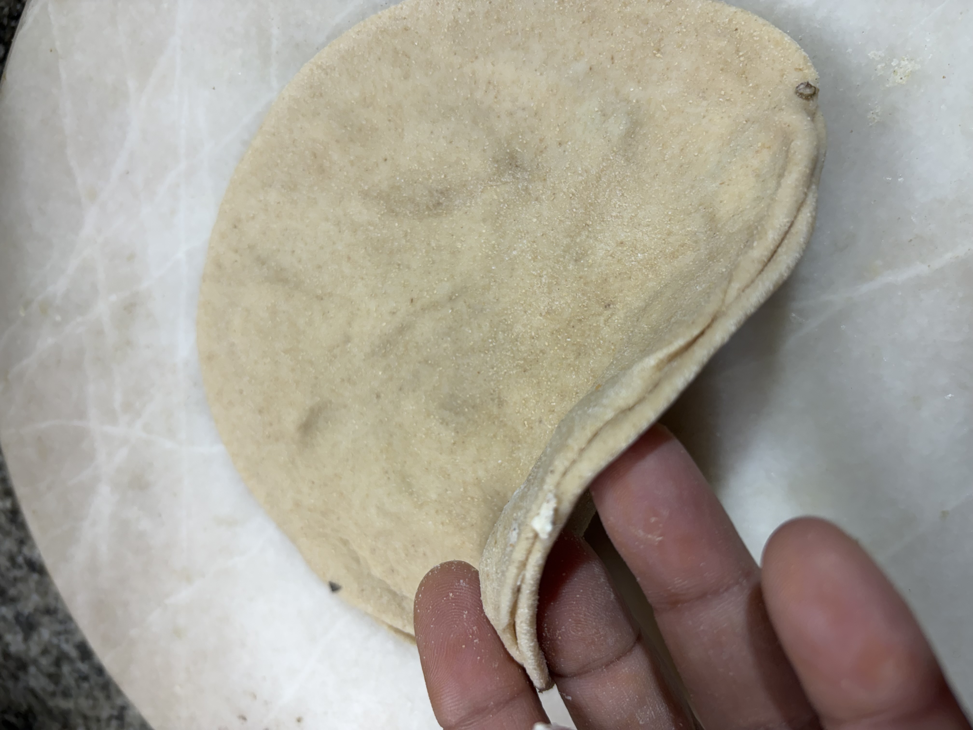 Step 4.2: Spread a generous spoonful of the curd filling evenly over one disc