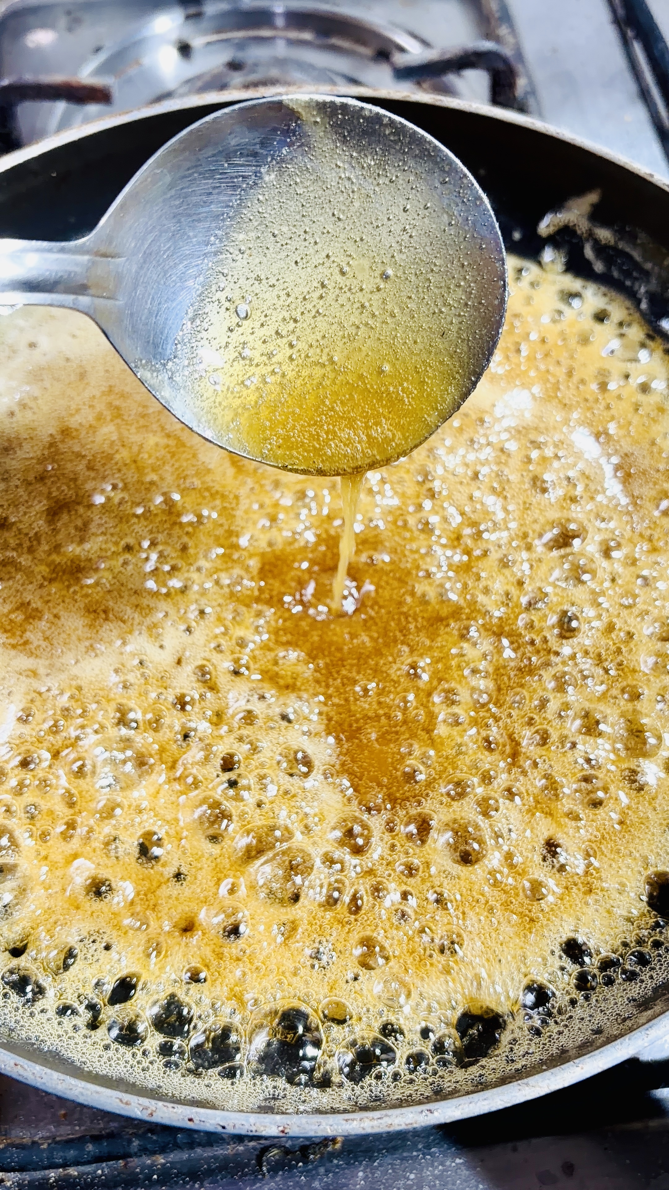 Step 2.1: Cook, stirring occasionally, until the jaggery melts completely and forms a smooth syrup