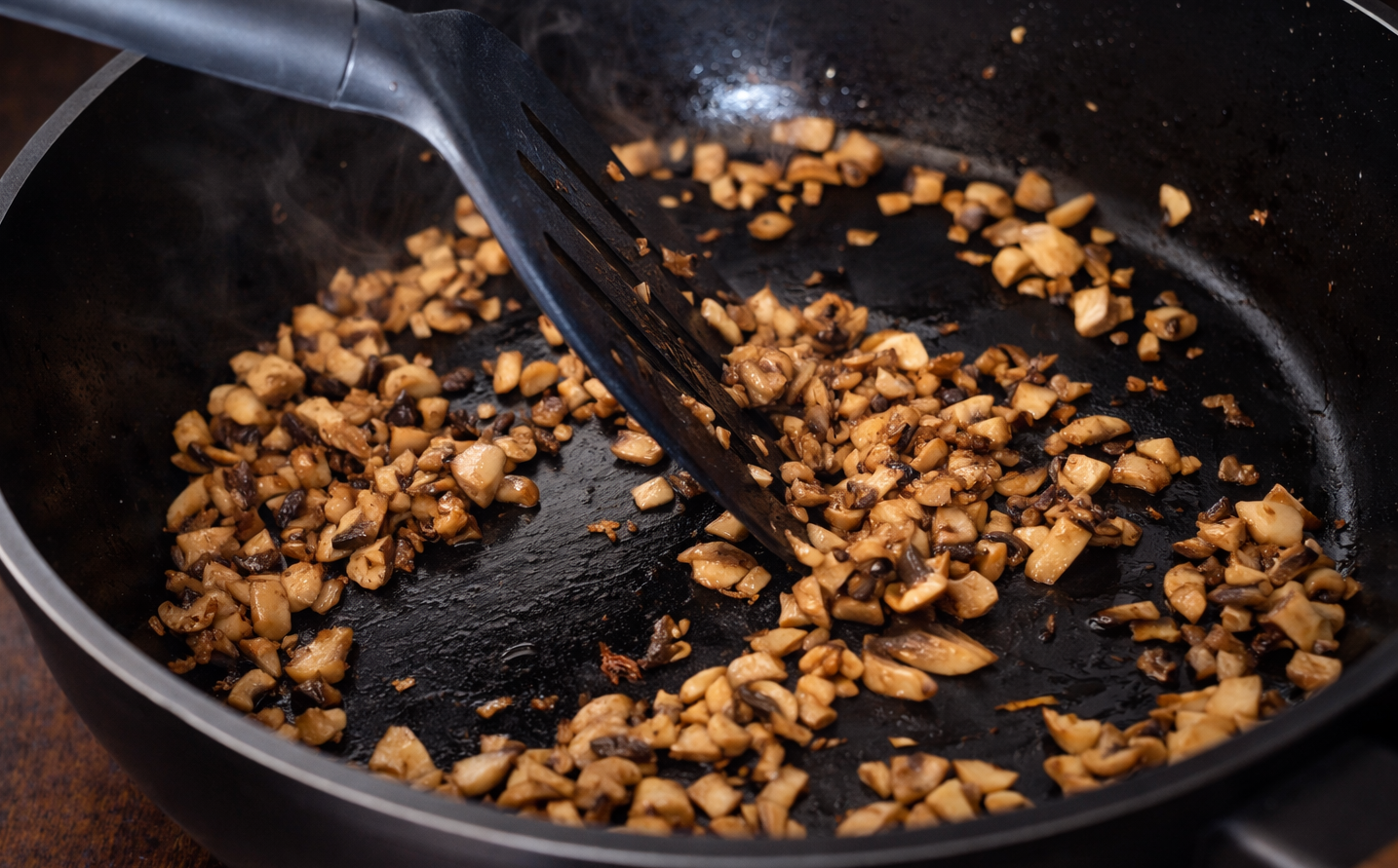 Step 2.1: Cook the mushrooms in a pan until fully done and all moisture has evaporated