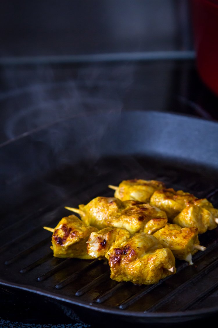 Step 1.1: When ready to cook, thread the marinated chicken pieces onto skewers